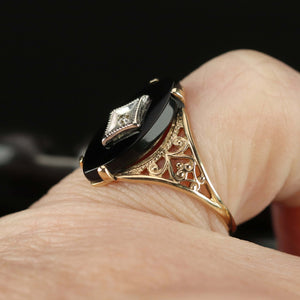 Vintage navette onyx and diamond ring in yellow gold