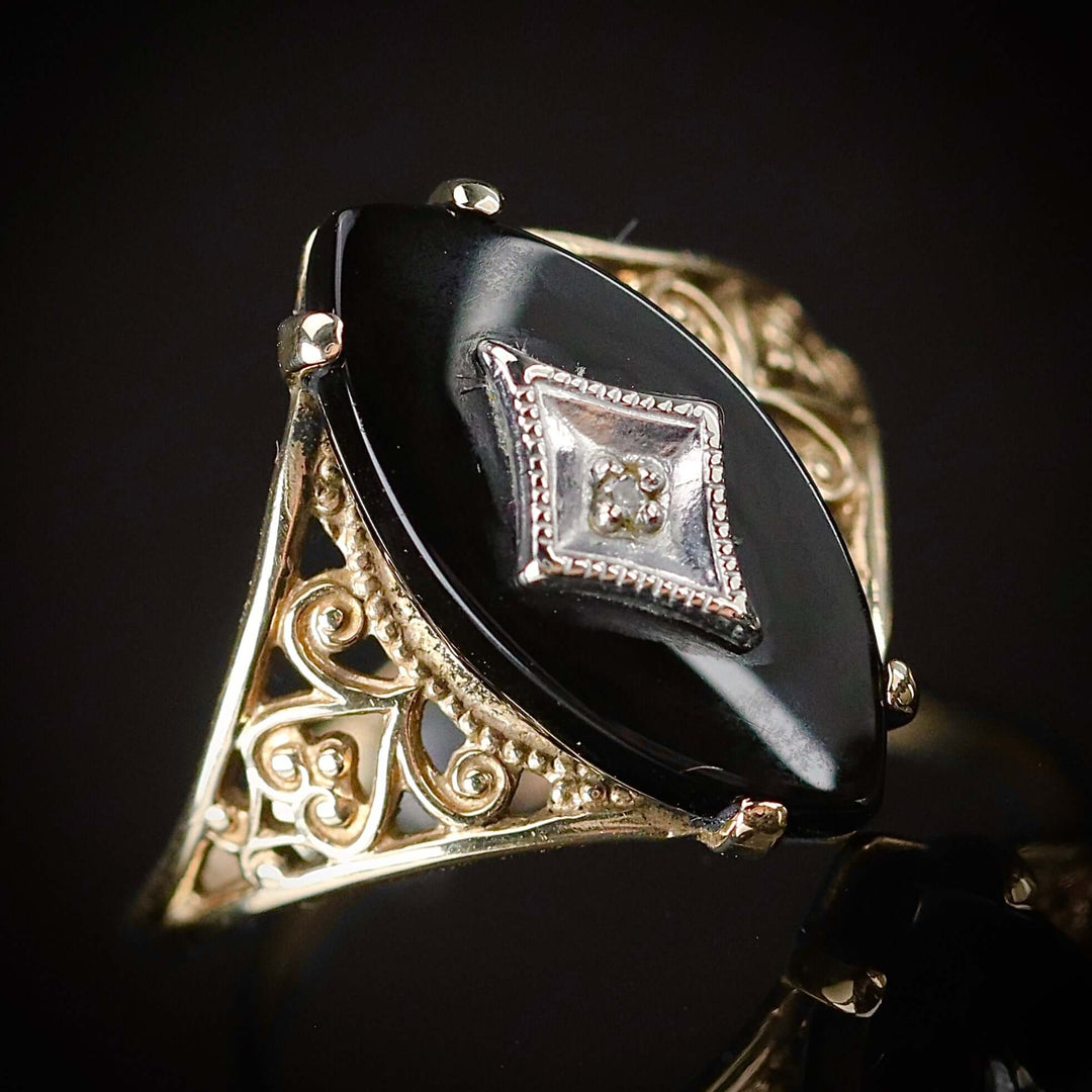 Vintage navette onyx and diamond ring in yellow gold