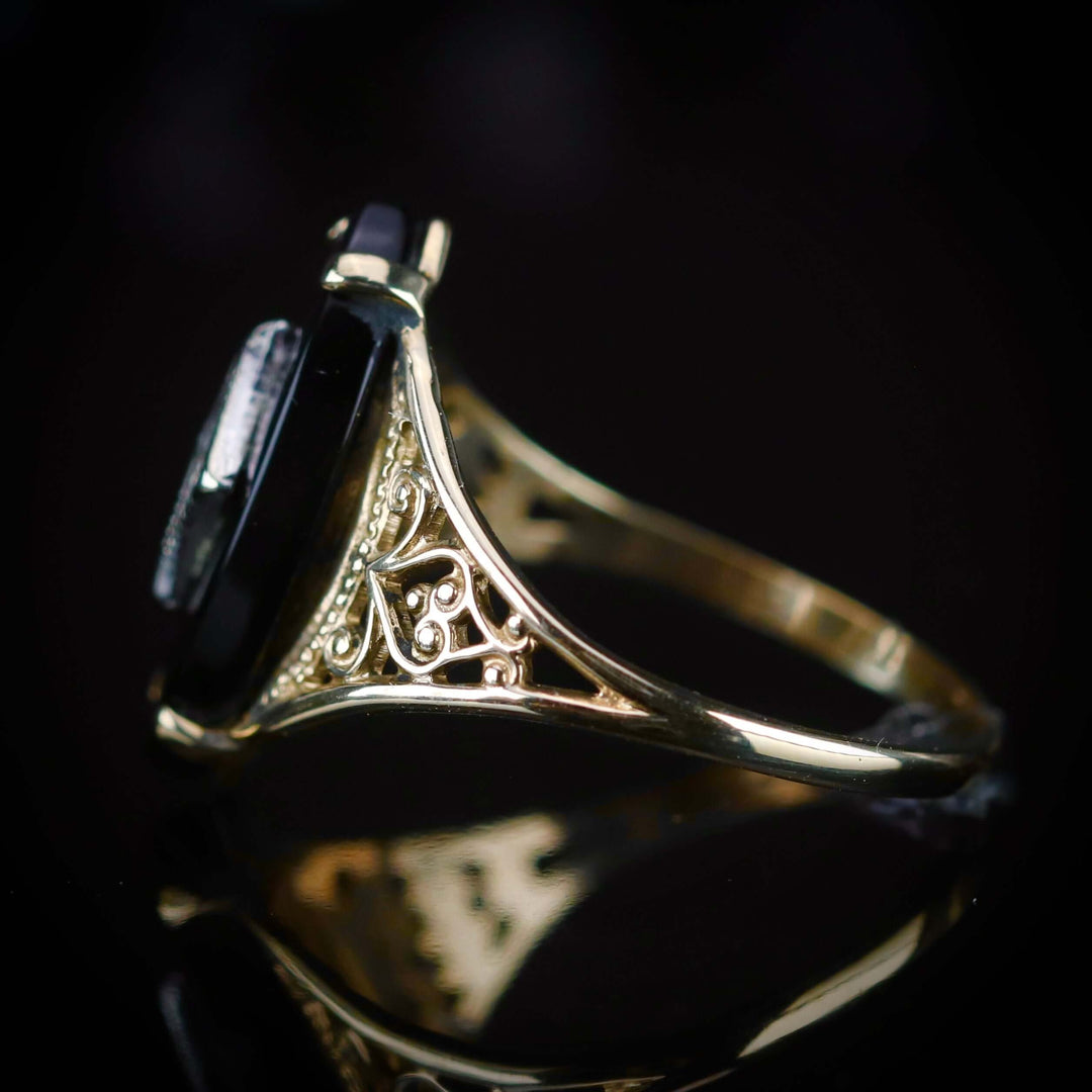 Vintage navette onyx and diamond ring in yellow gold