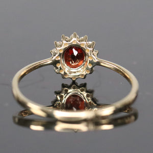 Garnet and diamond ring in yellow gold