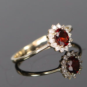 Garnet and diamond ring in yellow gold