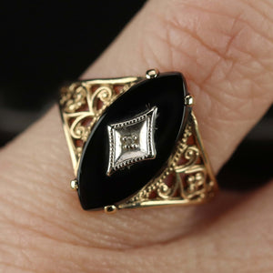 Vintage navette onyx and diamond ring in yellow gold