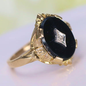 Vintage onyx and diamond ring in yellow gold