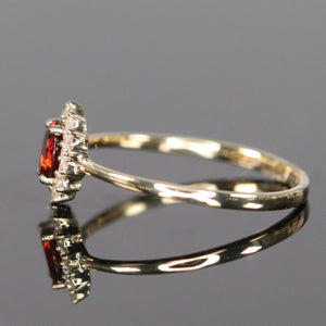 Garnet and diamond ring in yellow gold