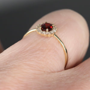 Garnet and diamond ring in yellow gold