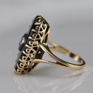 Classic vintage onyx and diamond ring in yellow gold