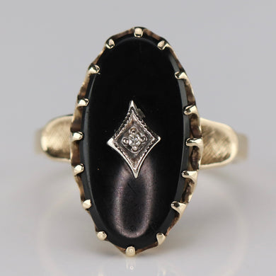 Classic vintage onyx and diamond ring in yellow gold