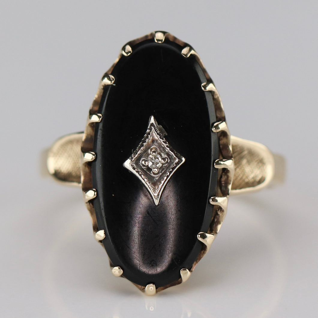 Classic vintage onyx and diamond ring in yellow gold