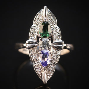 Estate platinum navette ring with diamonds, aquamarine, tanzanite, and tourmaline in platinum from Manor Jewels