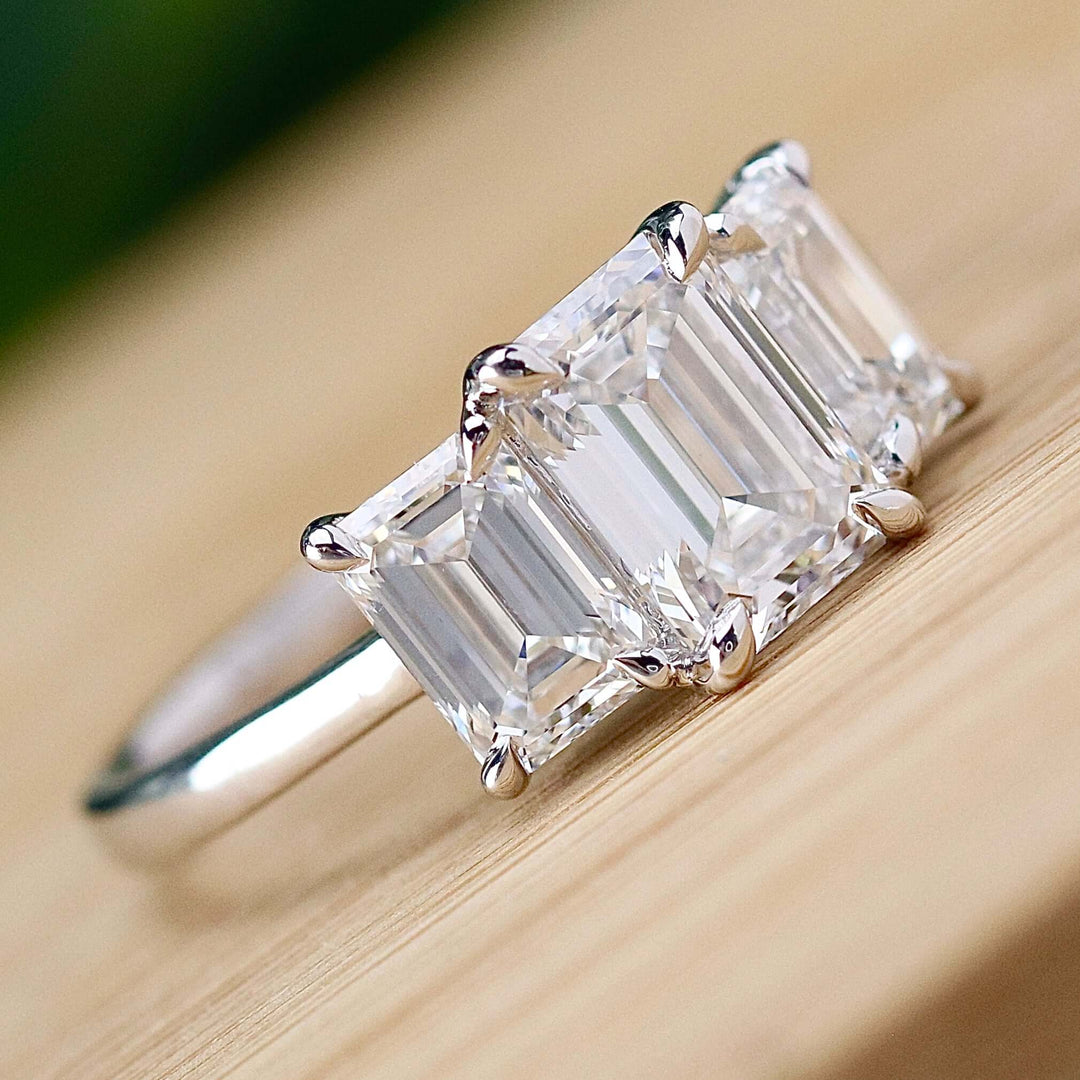 SPECIAL: MANOR ROYAL:  The Charlotte - 3 stone 3.03ctw lab grown emerald cut diamond ring in platinum