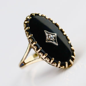 Classic vintage onyx and diamond ring in yellow gold