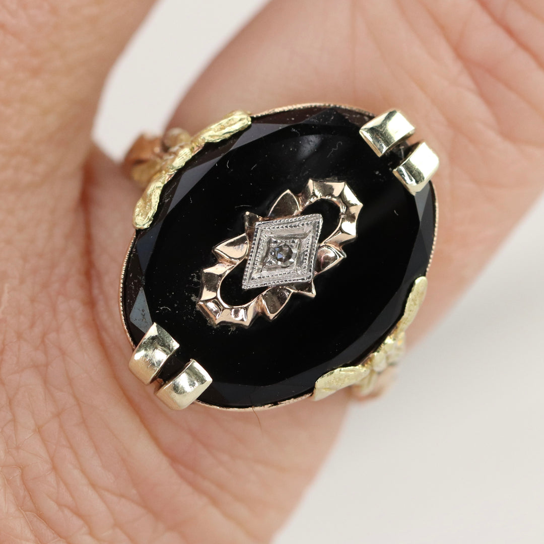 Vintage onyx and diamond ring in yellow gold