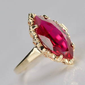 Lab grown Ruby navette ring in 10k yellow gold