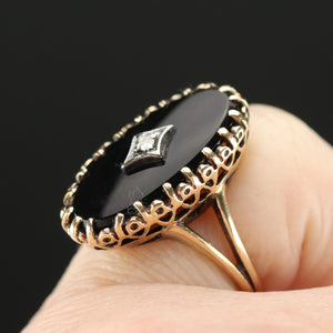 Classic vintage onyx and diamond ring in yellow gold