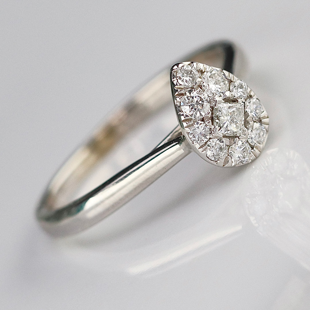 Pear shape diamond cluster ring in 14k white gold