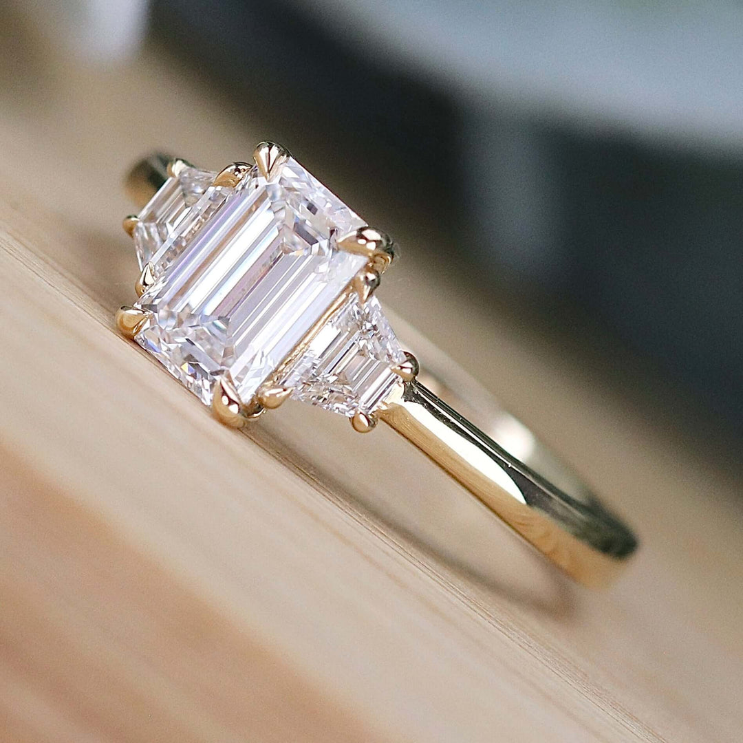 SPECIAL:  MANOR ROYAL:  The Queen Anne - 3 stone 1.40ctw lab grown emerald cut diamond ring in 14k yellow gold