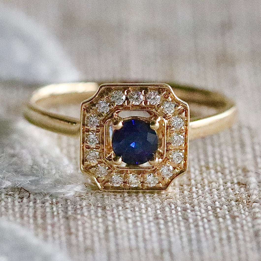 Sapphire and diamond halo ring in 14k yellow gold