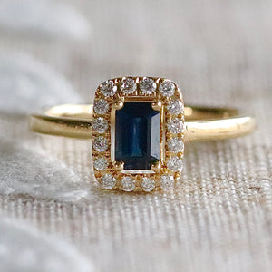 Sapphire and diamond halo ring in 14k yellow gold