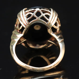 Large oval vintage black onyx and diamond ring in yellow gold ring