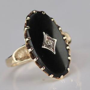 Classic vintage onyx and diamond ring in yellow gold