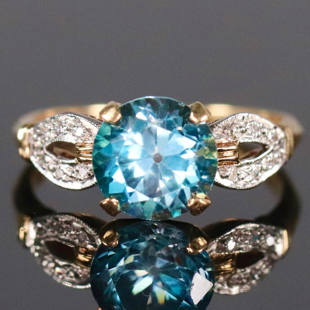 Vintage ring with blue zircon and diamonds in 14k yellow gold