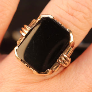 Heavy vintage onyx ring in yellow gold