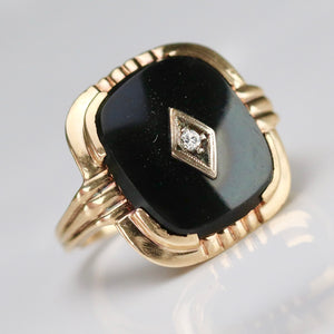 Vintage cushion cut onyx and diamond ring in yellow gold