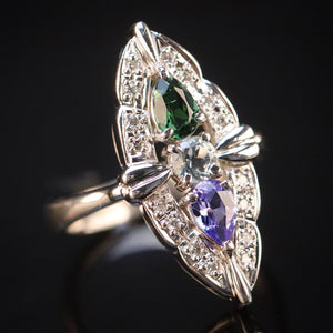 Estate platinum navette ring with diamonds, aquamarine, tanzanite, and tourmaline in platinum from Manor Jewels