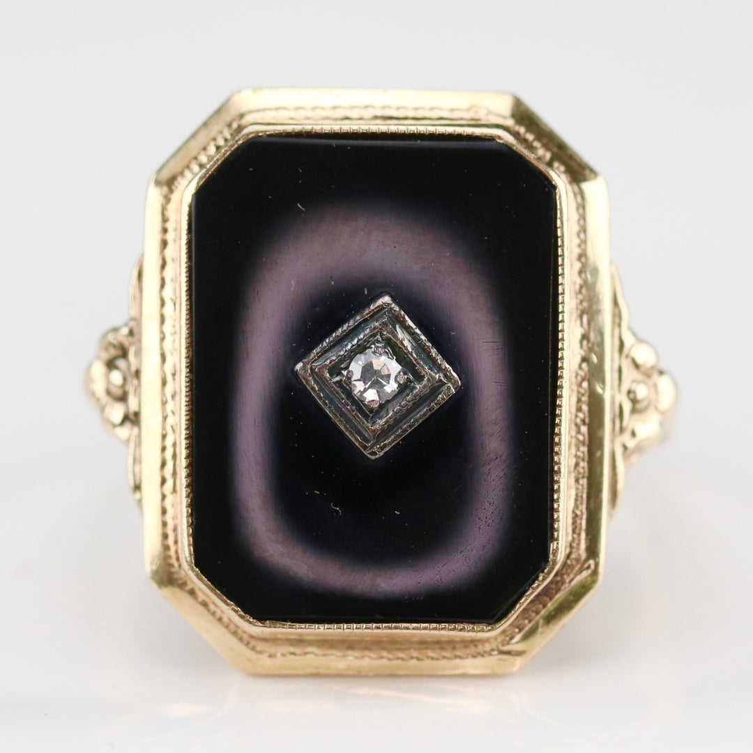 Vintage onyx and diamond ring in yellow gold