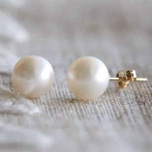 Classic pearl studs in 14k yellow gold