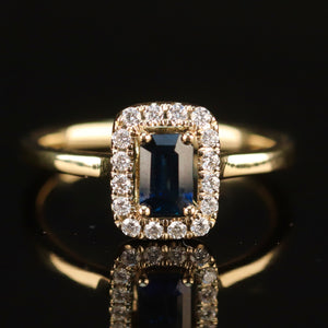 Sapphire and diamond halo ring in 14k yellow gold