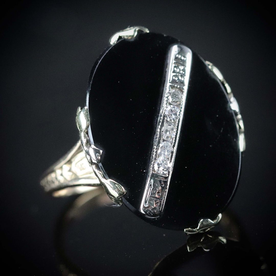 Vintage onyx and diamond ring in yellow gold