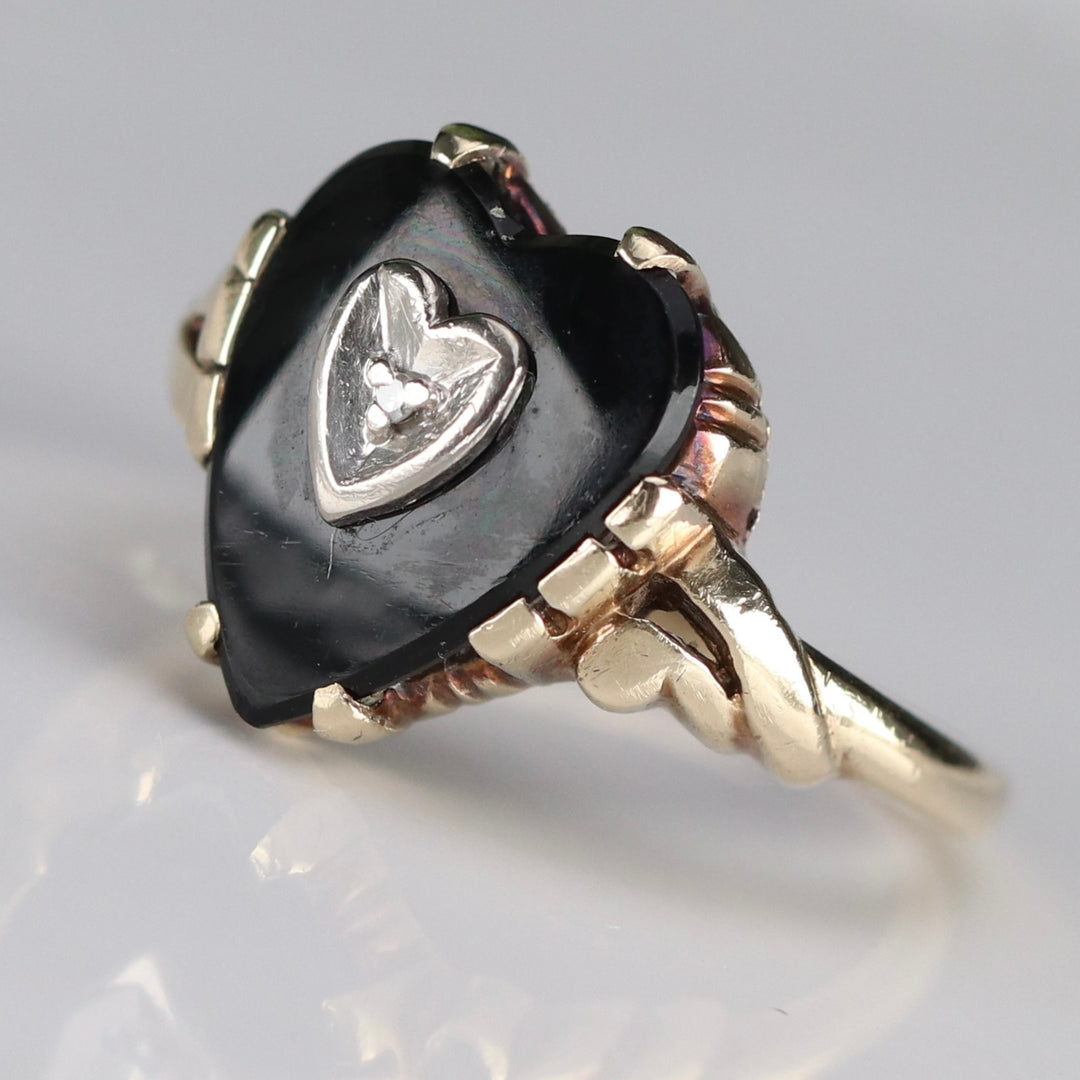 Heart shaped onyx and diamond ring in yellow gold