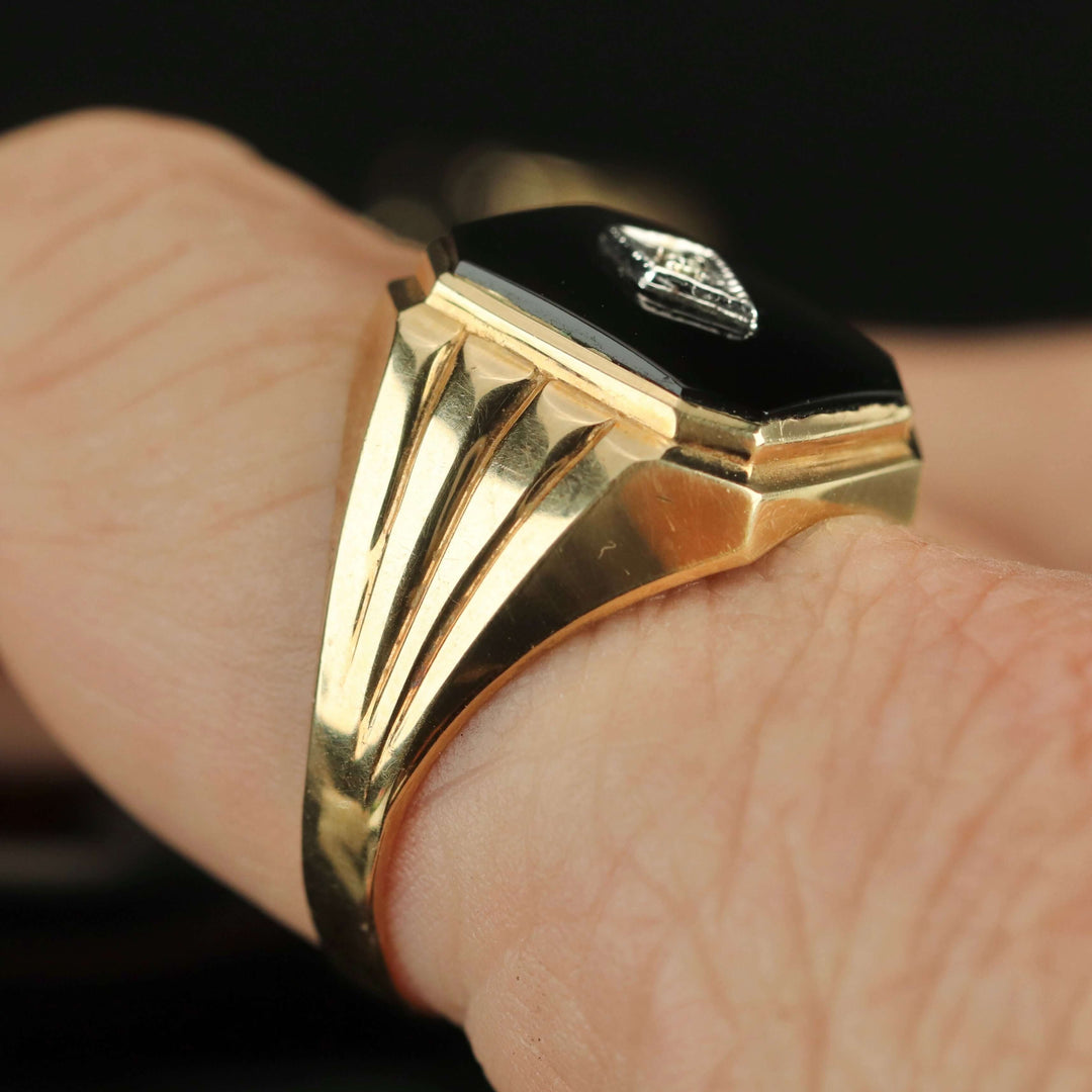 Vintage large onyx and diamond ring in yellow gold