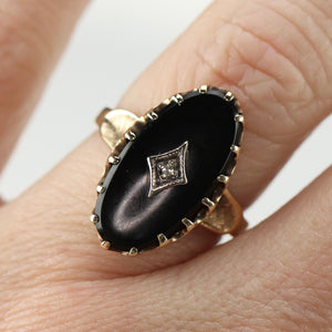 Classic vintage onyx and diamond ring in yellow gold