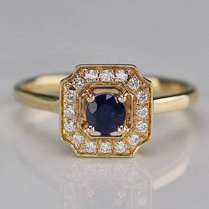 Sapphire and diamond halo ring in 14k yellow gold