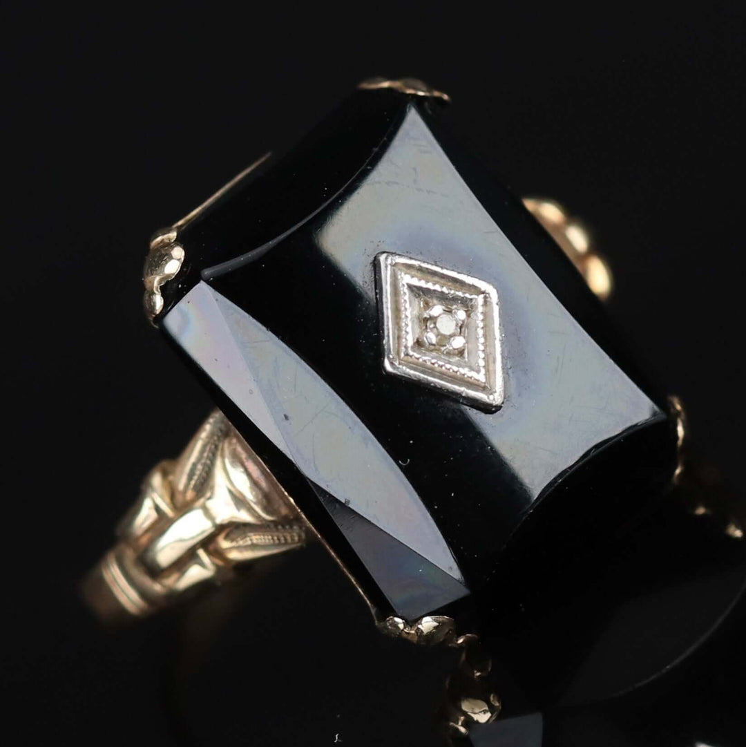 Vintage faceted Onyx and diamond ring in yellow gold