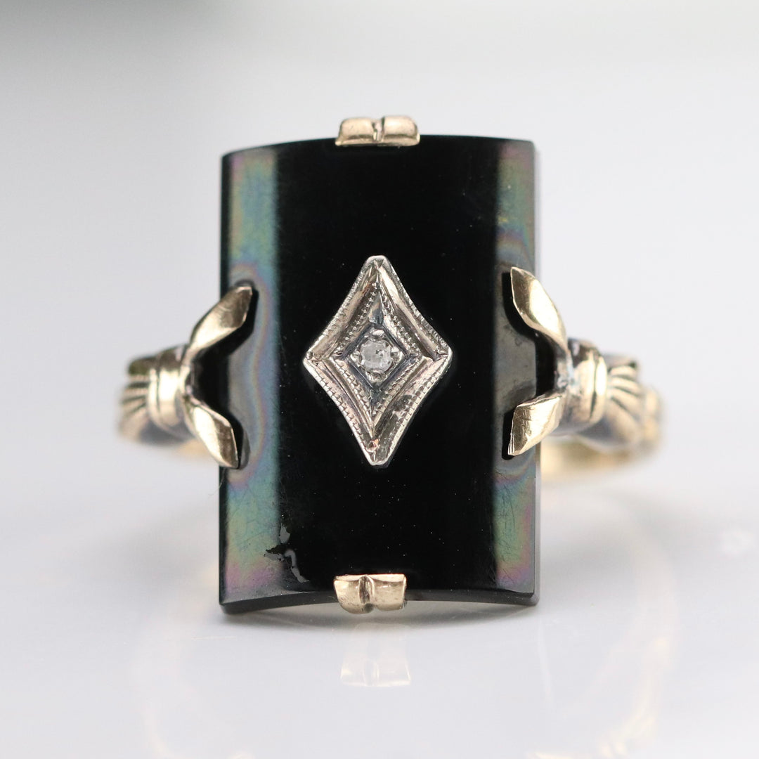 Vintage curved onyx and diamond ring in yellow gold