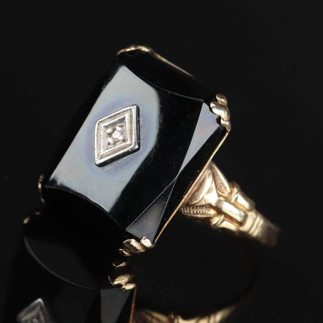 Vintage faceted Onyx and diamond ring in yellow gold