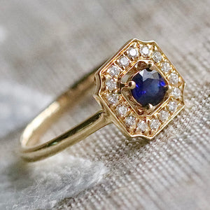 Sapphire and diamond halo ring in 14k yellow gold