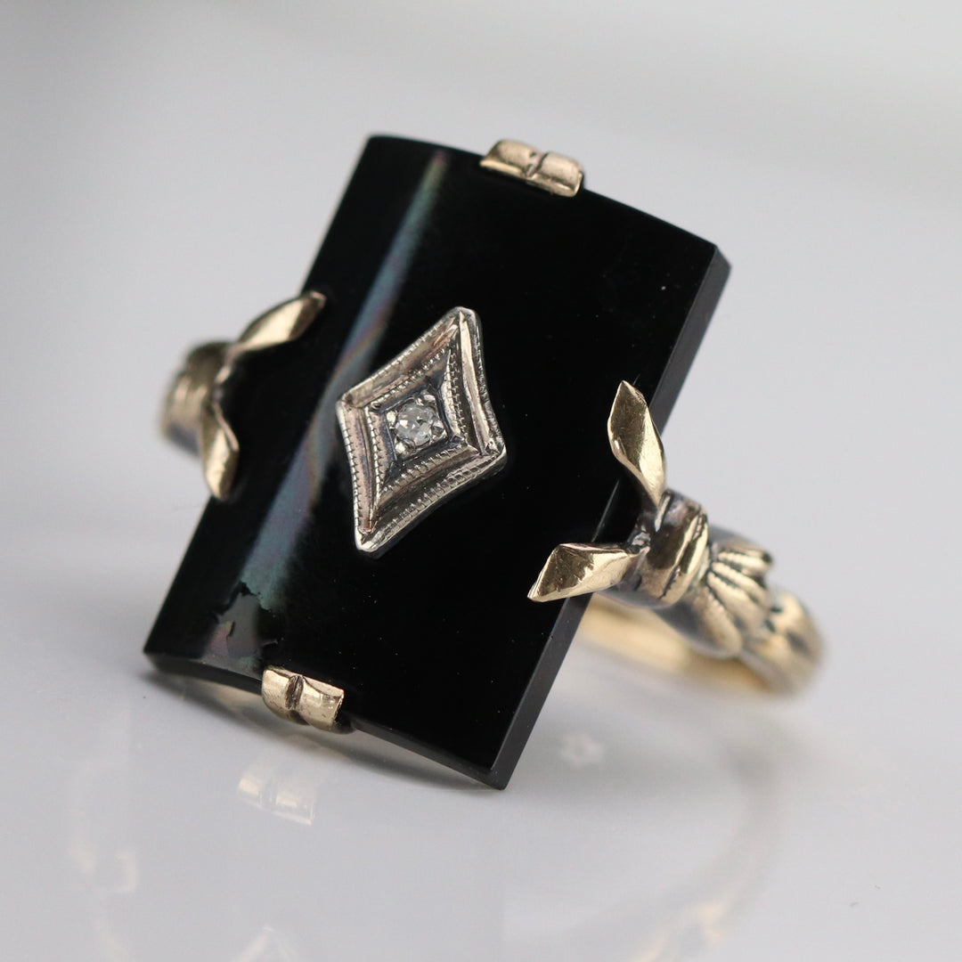 Vintage curved onyx and diamond ring in yellow gold