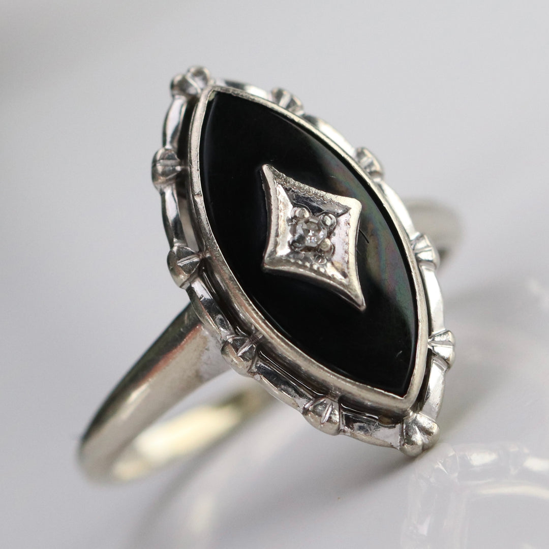 Vintage navette onyx and diamond ring in white gold