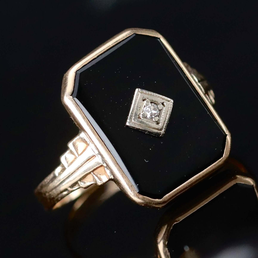 Classic vintage onyx and diamond ring in yellow gold