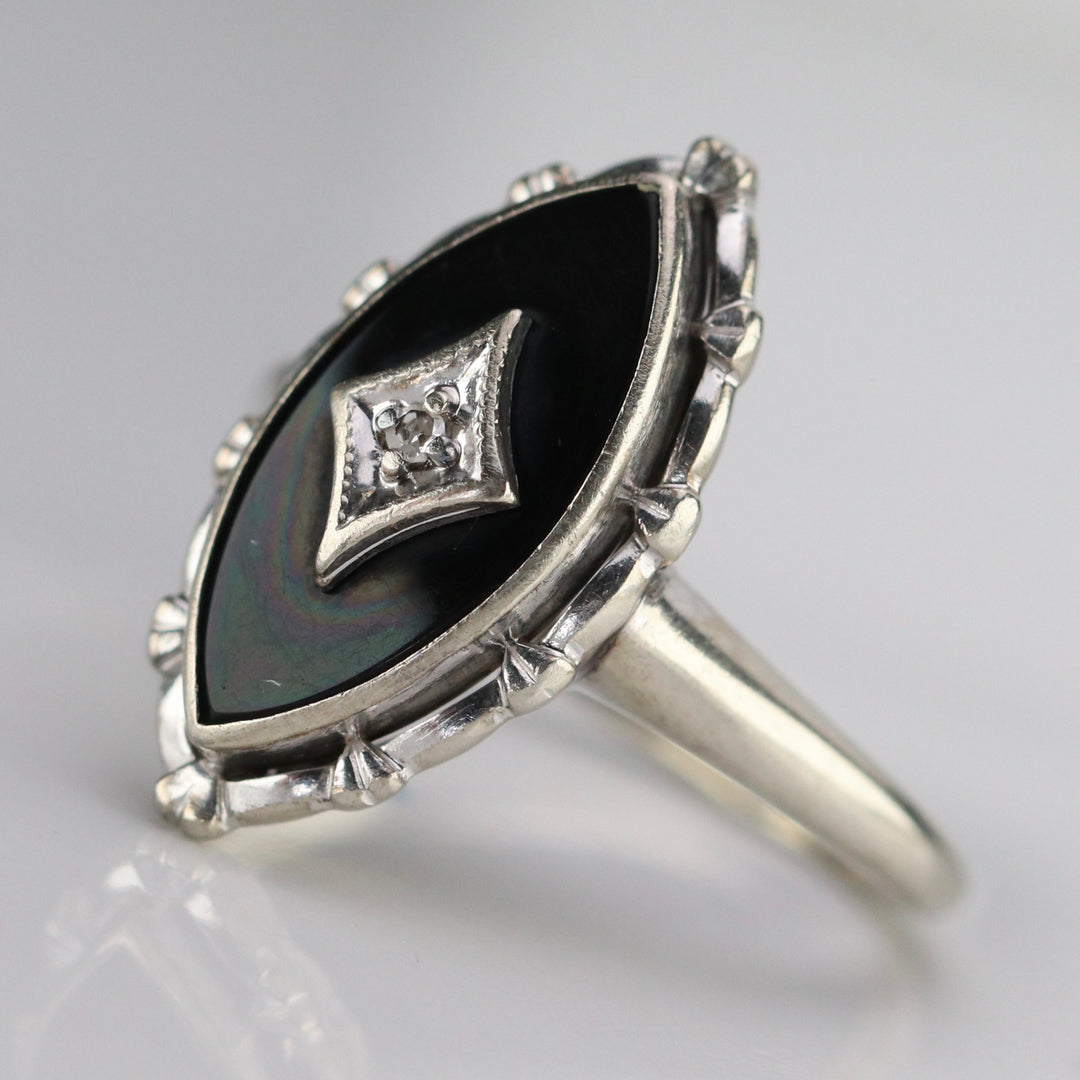 Vintage navette onyx and diamond ring in white gold