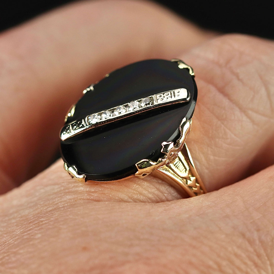 Vintage onyx and diamond ring in yellow gold