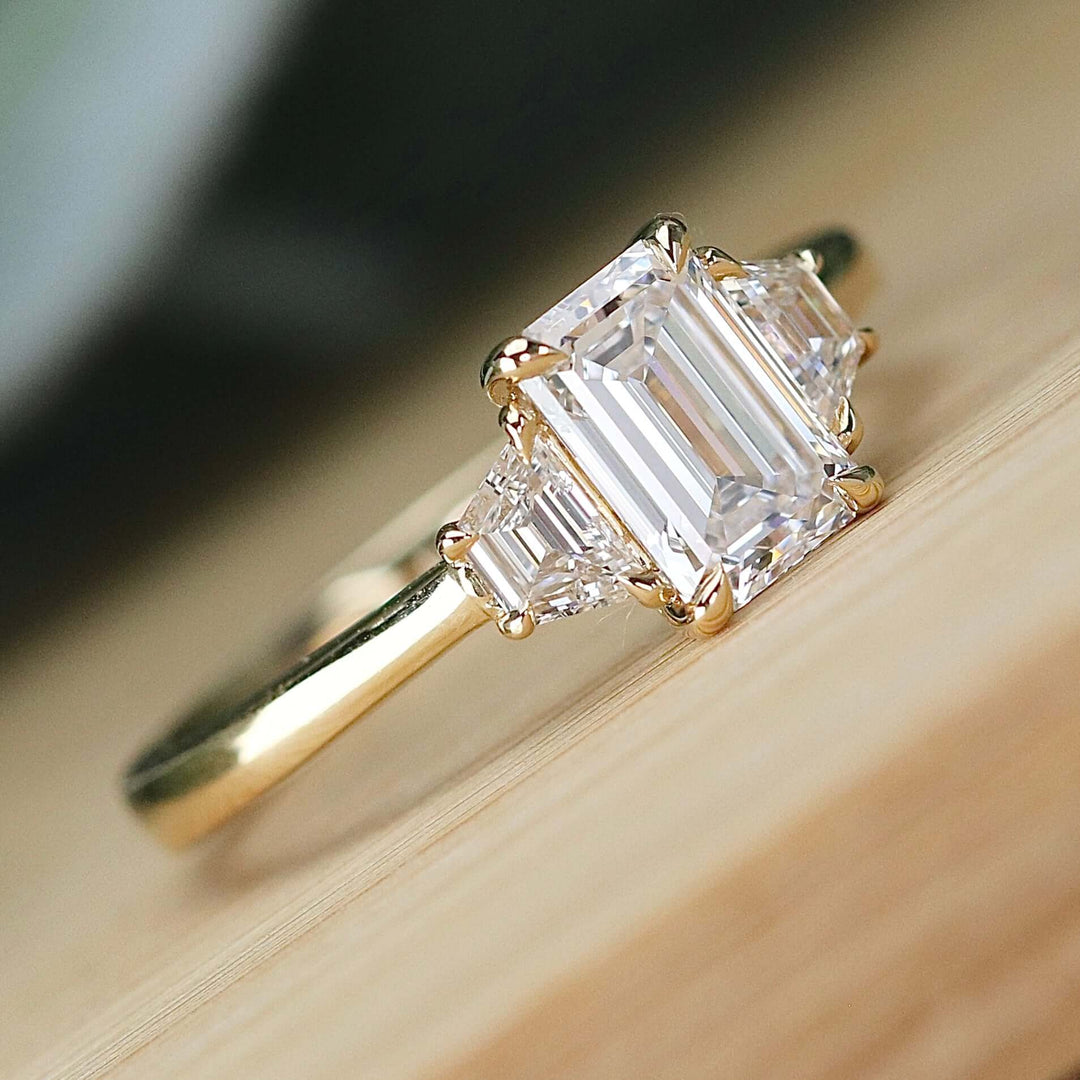 SPECIAL:  MANOR ROYAL:  The Queen Anne - 3 stone 1.40ctw lab grown emerald cut diamond ring in 14k yellow gold