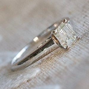 Estate emerald cut diamond solitaire ring in 18k white gold