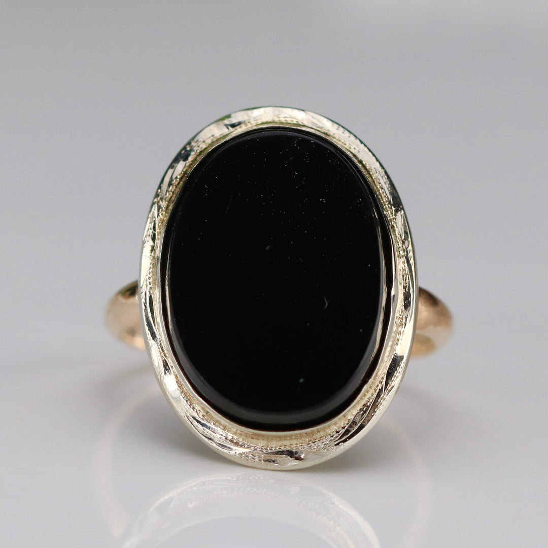 Classic oval onyx vintage ring in yellow and white gold