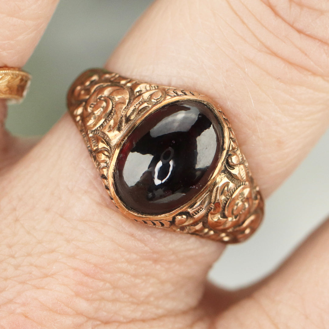 Antique garnet cabochon ring in rose gold