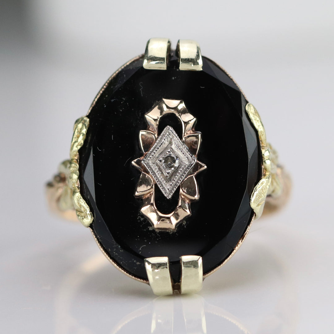 Vintage onyx and diamond ring in yellow gold